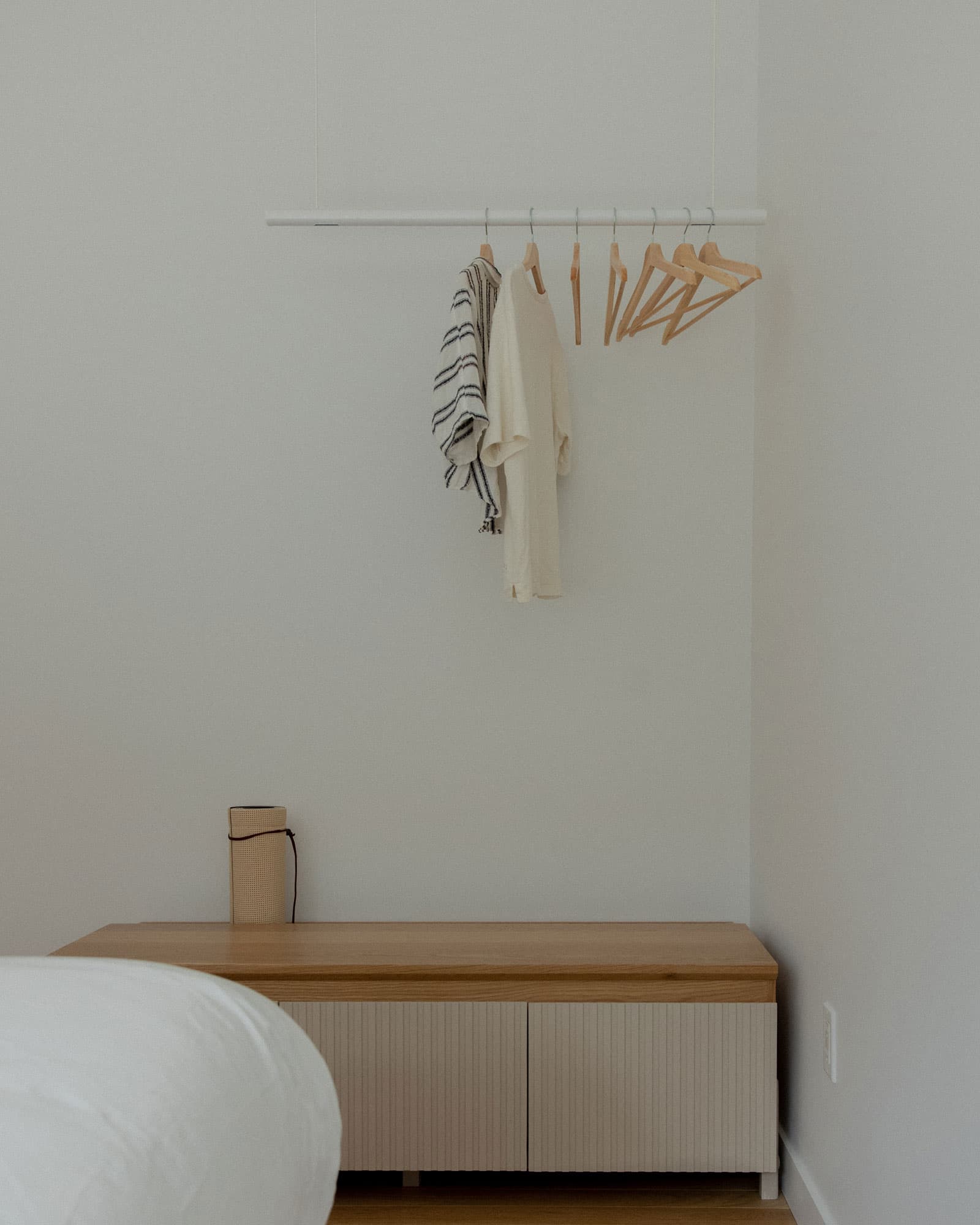 Modern room with a white hanging clothing rack