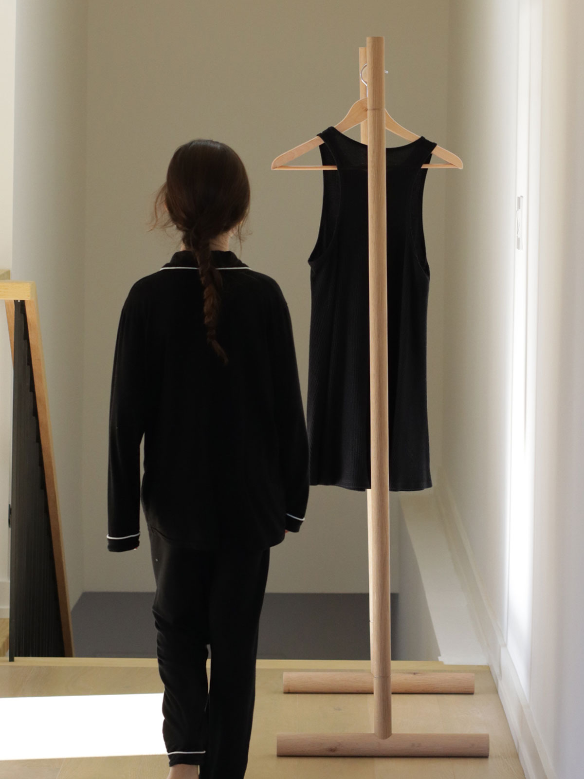 Standing wooden garment rack